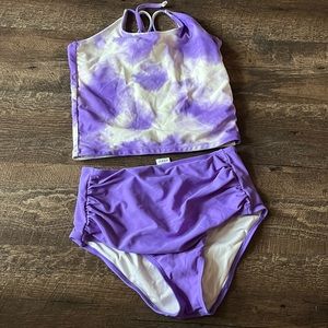 Purple and white swimsuit from coral reef. Size small. Great condition.